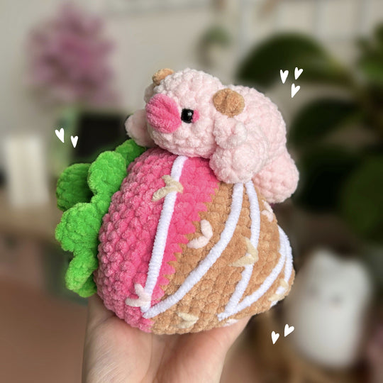 Kuh auf einer Erdbeere