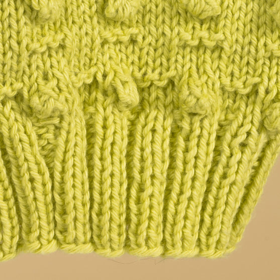 

Poppy - Kinderstrickjacke
4